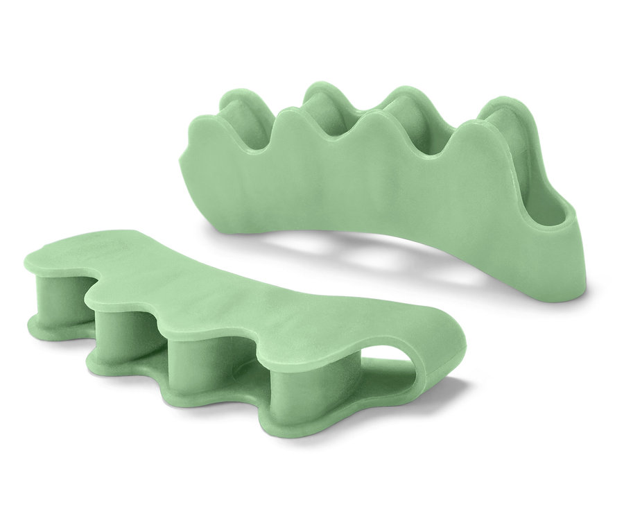 Dwa zielone separatory do palców stóp.