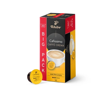 Opakowanie 30 kapsułek Caffè Crema Mild. Pudełko jest czerwono-czarno-żółte. Obok opakowania leży kapsułka.