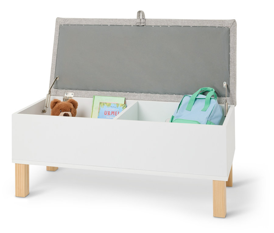 Otwarty biały pojemnik na zabawki z pluszowym misiem, książką i jasnoniebieskim plecakiem.