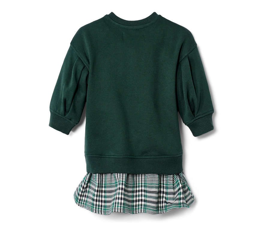 Zielona sukienka z kraciastą spódnicą z tyłu.