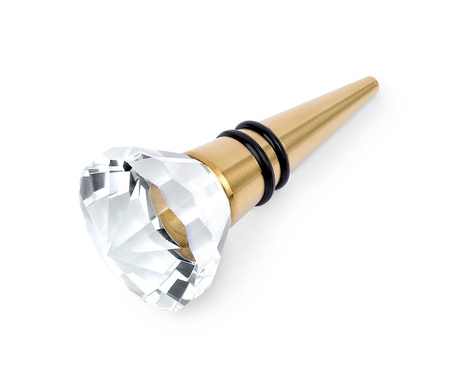 Złoty korek do butelki z kryształową ozdobą.