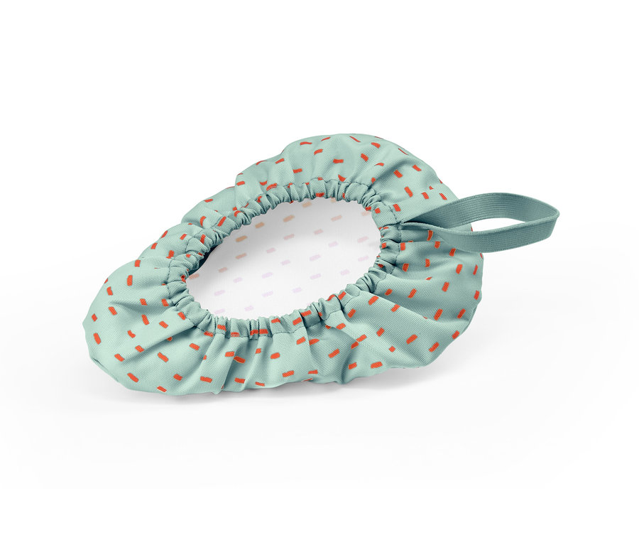 Pokrowiec na siodełko rowerowe dla dzieci z pomarańczowymi prostokątami na zielonym tle.