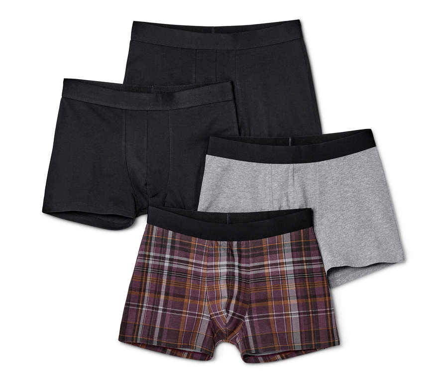 Cztery pary bokserek: dwie czarne, jedna szara i jedna w kratę.