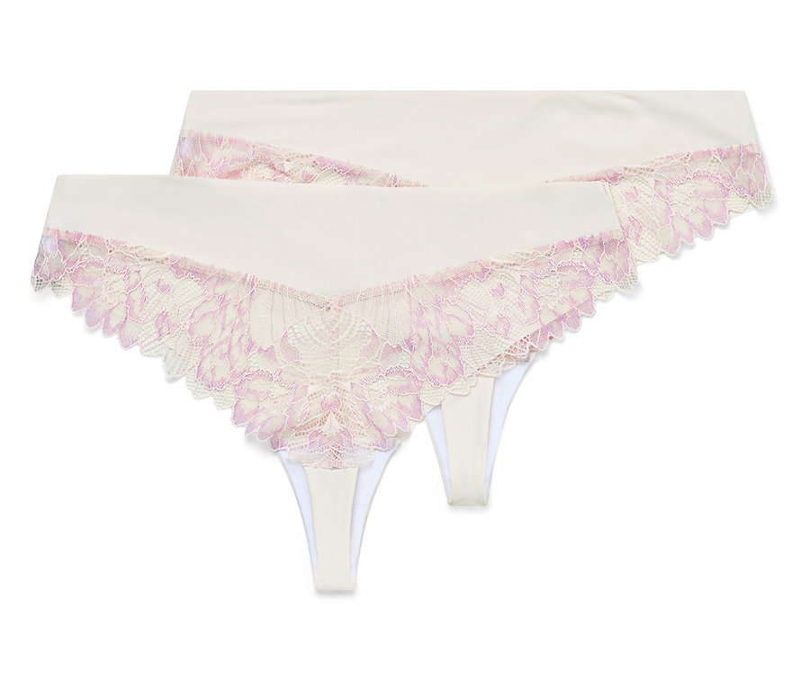 Dwie białe stringi z różową koronką leżą na sobie.