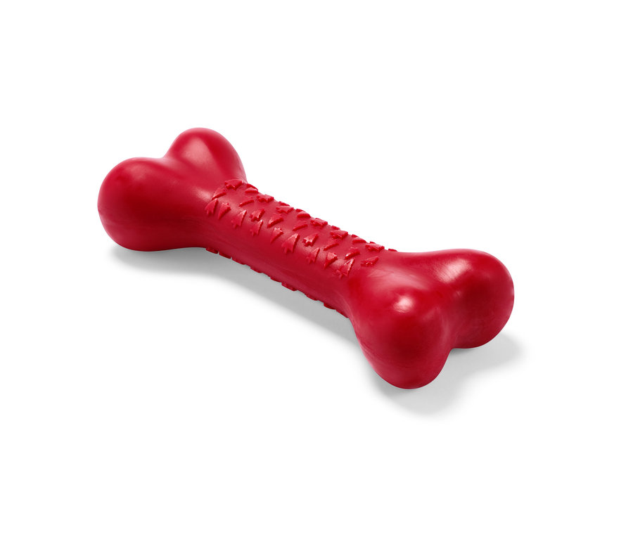 Czerwona zabawka dla psa w kształcie kości.