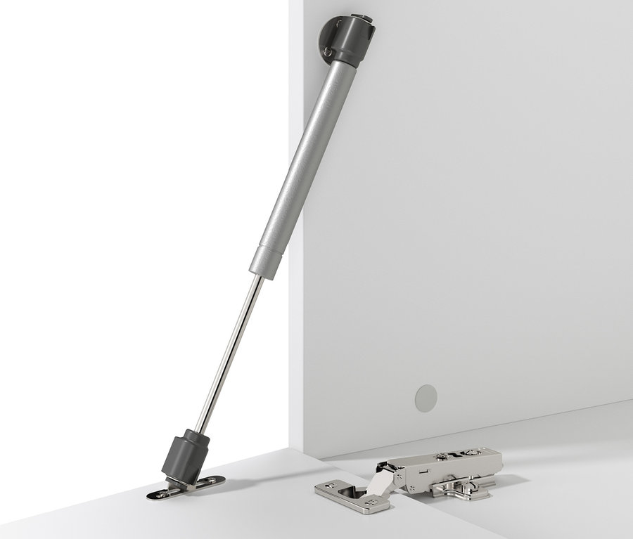 Mechanizm zamykający i zawias na białej powierzchni.