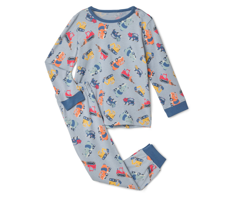 Na białym tle leży szara piżama z wzorem pojazdów budowlanych.