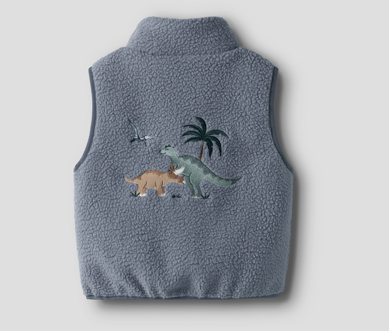Szara kamizelka teddy NAME IT z haftem dinozaurów i palm.