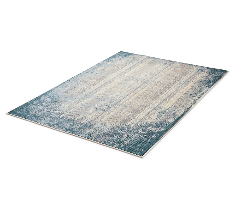 Beżowo-niebieski dywan w stylu vintage.