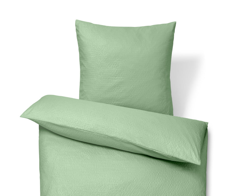 Zielona pościel z kory w rozmiarze standardowym i pościel z kory w rozmiarze niestandardowym.