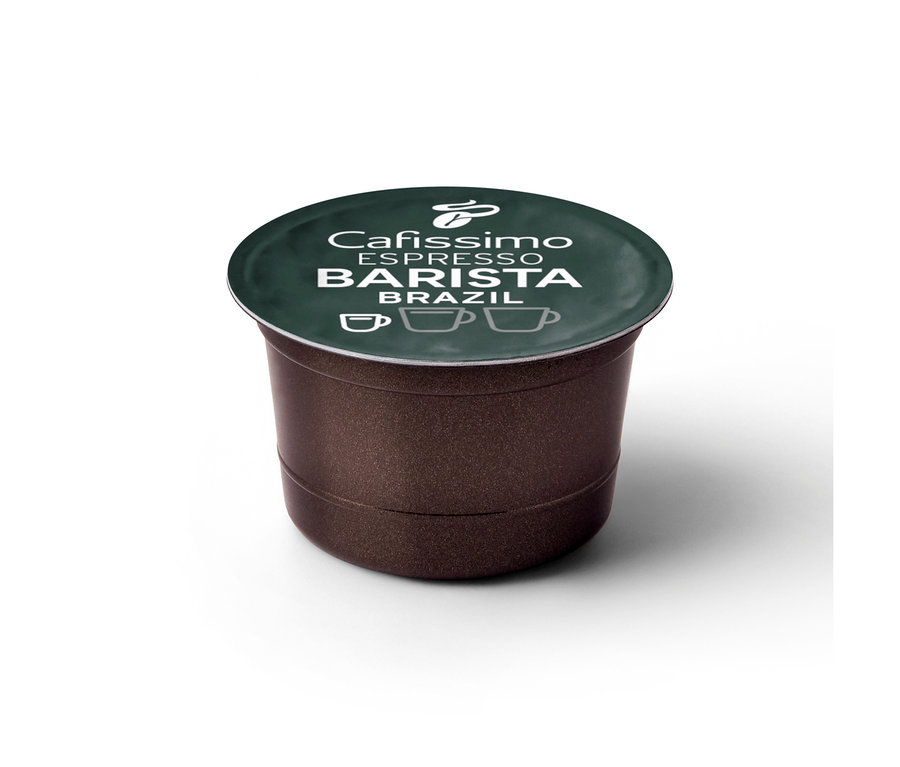 Pojedyncza brązowa kapsułka kawy Tchibo Cafissimo Barista Espresso Brasil z ciemnozielonym wieczkiem. Na wieczku widnieje biały napis 'Cafissimo ESPRESSO BARISTA BRAZIL' oraz logo Tchibo i trzy ikony filiżanek kawy.