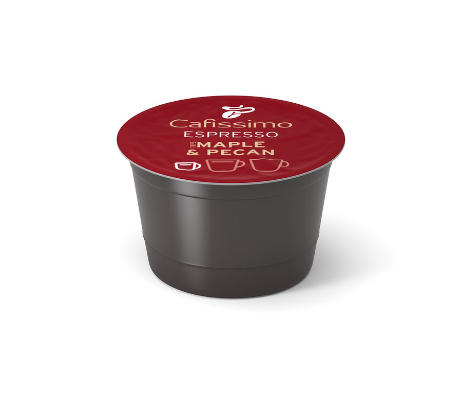 Ciemnoszara kapsułka kawy Cafissimo z czerwonym wieczkiem, na którym widnieje napis "Espresso Maple & Pecan" i ikony filiżanek.