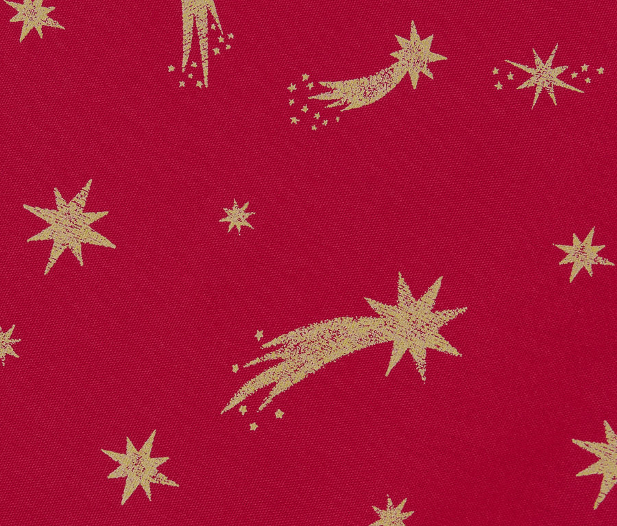 Detale bawełnianego bieżnika ze złotym wzorem gwiazd na czerwonym tle.