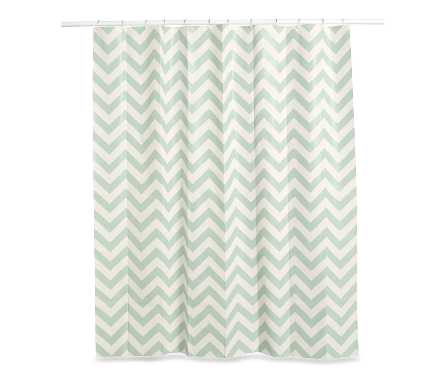 Zasłona prysznicowa z białym i zielonym wzorem w zygzaki.