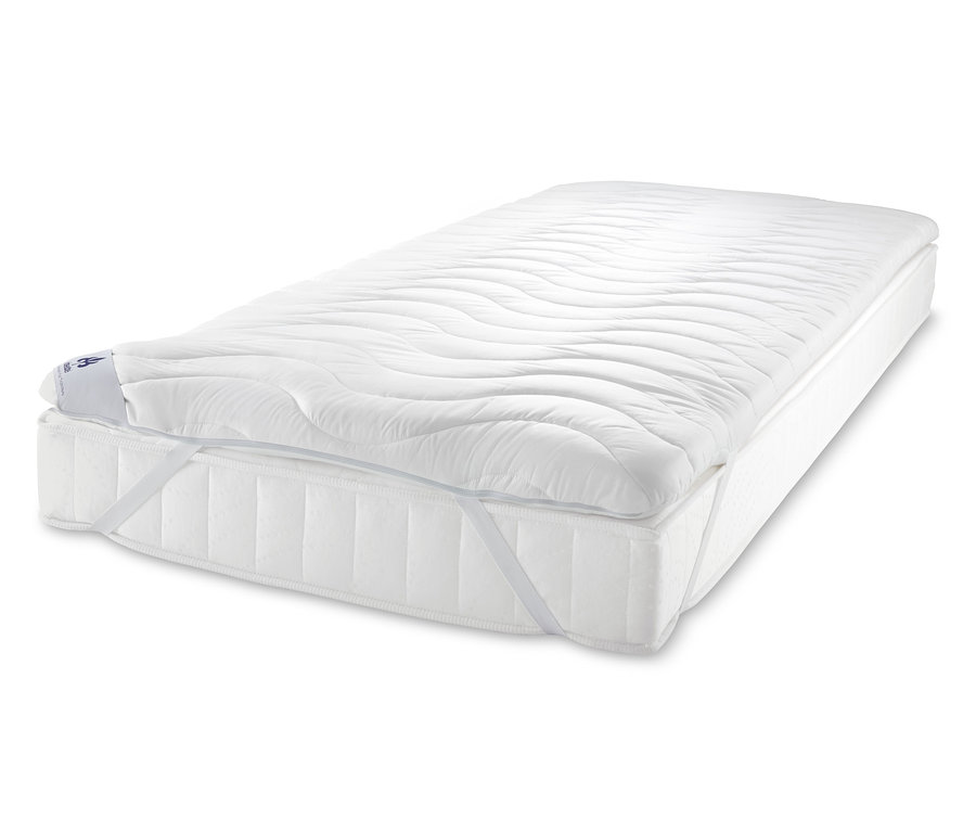 Biała nakładka na materac irisette® leży na materacu.