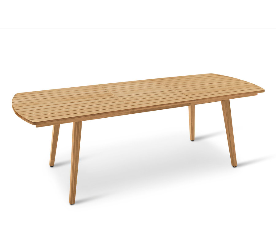 Rozkładany, prostokątny drewniany stół z zaokrąglonymi końcami i czterema stożkowymi nogami.