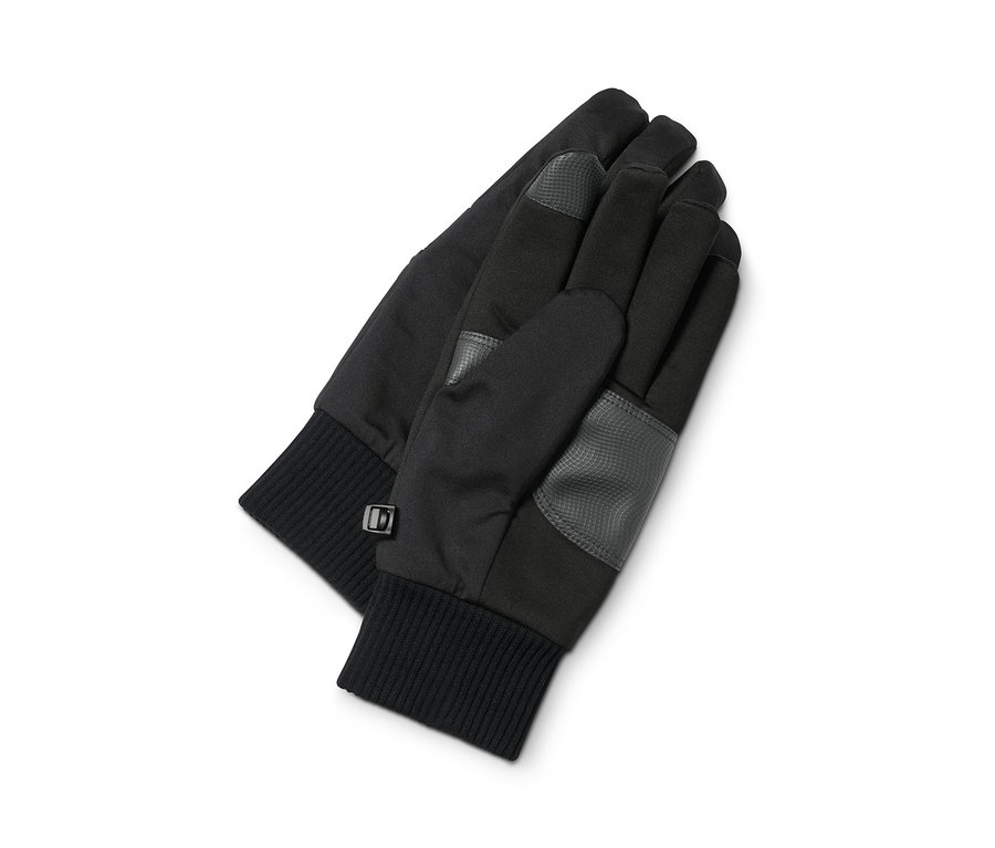 Dwie rękawiczki softshell leżą na białym tle.
