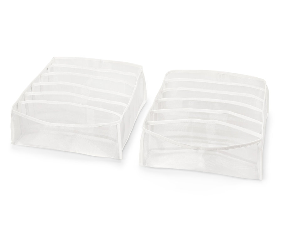 Dwa białe organizery do szuflad z przegródkami na białym tle.