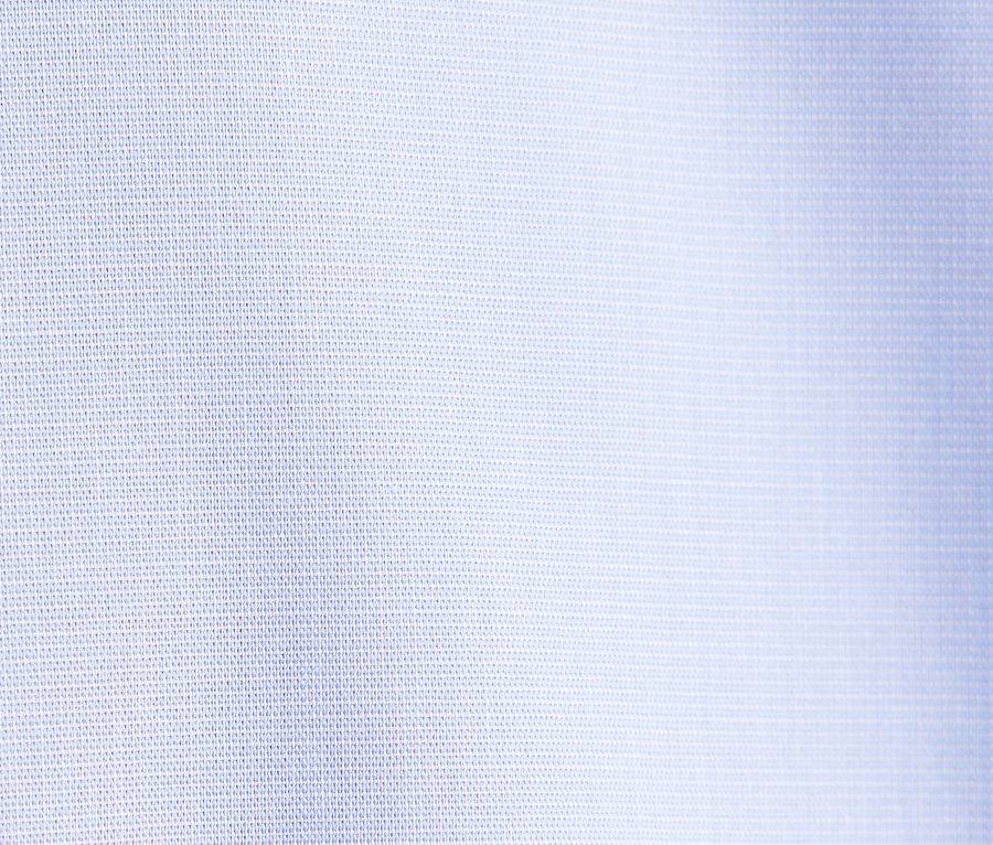 Szczegół jasnoniebieskiej tkaniny.