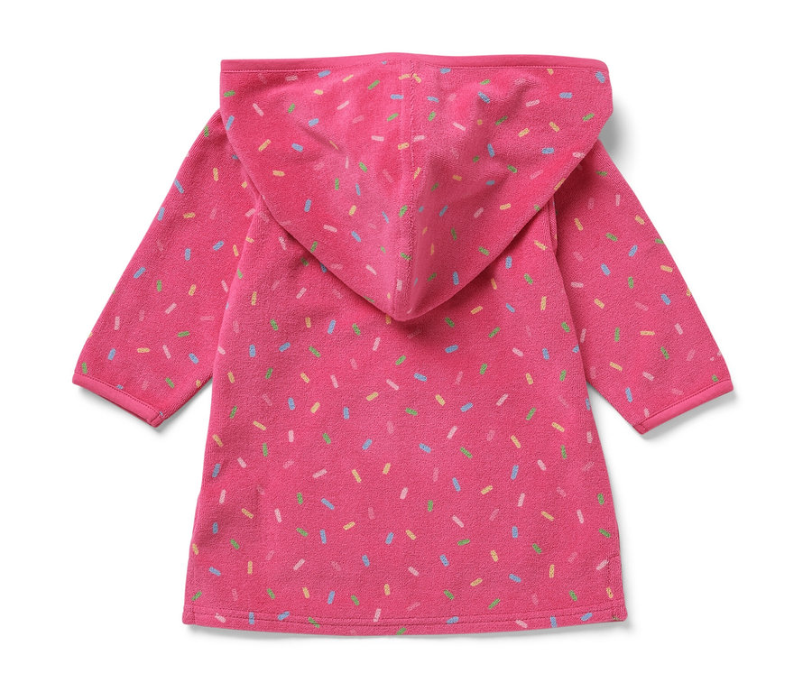 Różowe ponczo z tkaniny frotté dla dzieci z kapturem i kolorowymi posypkami.