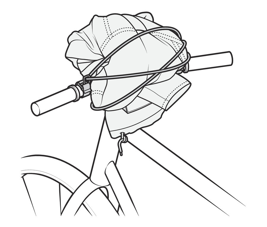 Kierownica roweru z taśmą elastyczną mocującą ładunek.