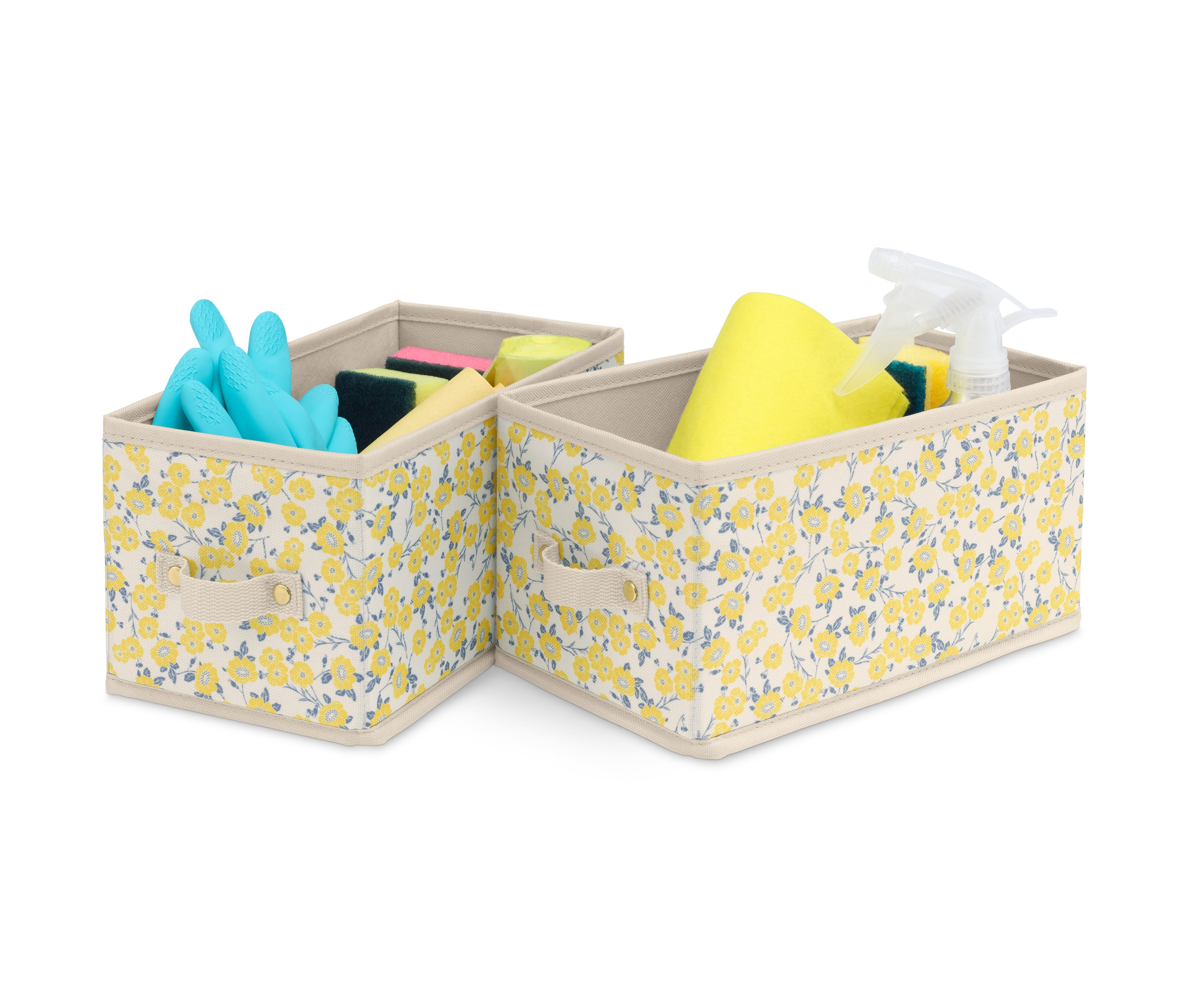 Dwa małe pojemniki do szuflad we wzór kwiatowy, w jednym niebieskie rękawice i gąbki, w drugim żółta ścierka, gąbki i spray.