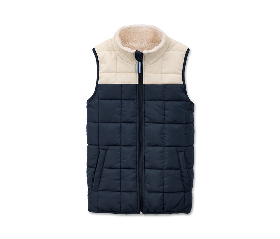 Kamizelka pikowana z kremowym obszyciem i granatową dolną częścią.