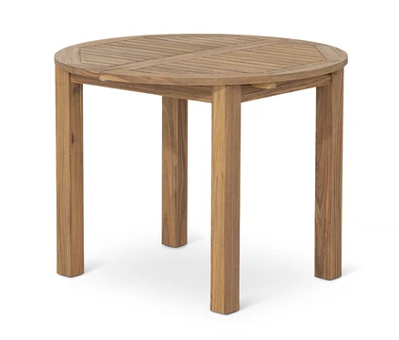 Okrągły stół rozsuwany z litego drewna z czterema nogami.