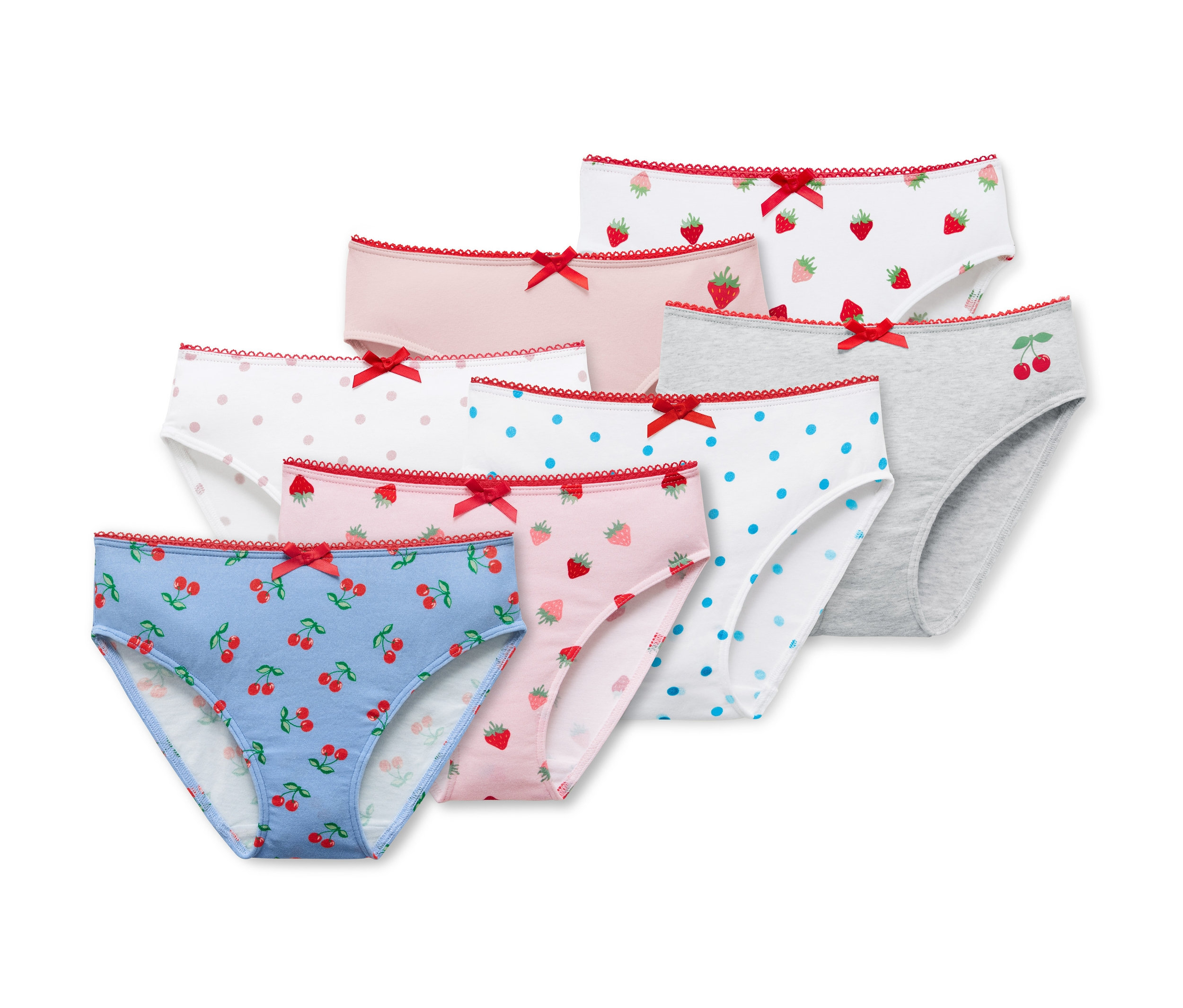 Siedem par fig dziewczęcych we wzory, w tym wisienki, truskawki i kropki.