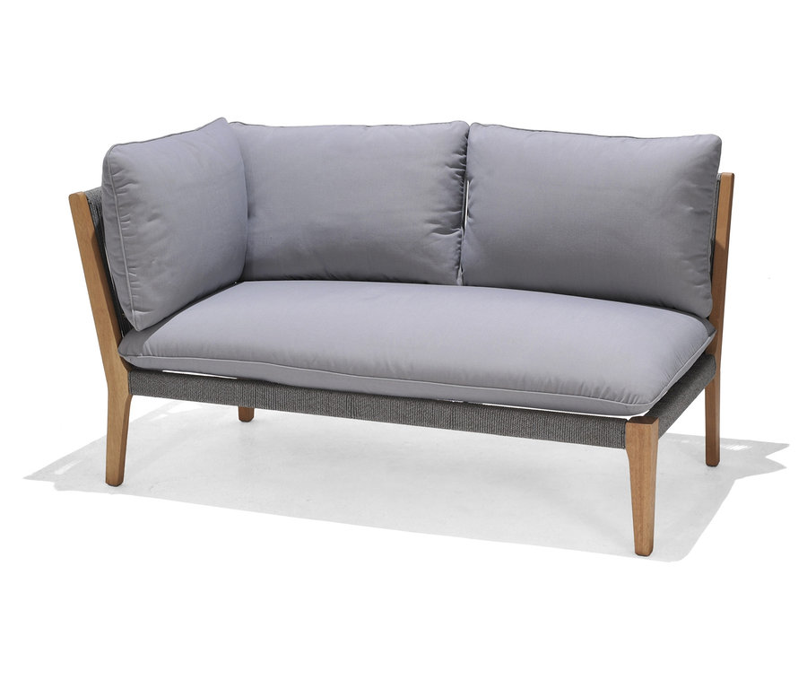 Szara sofa dwuosobowa z modułem i wygodną poduszką.