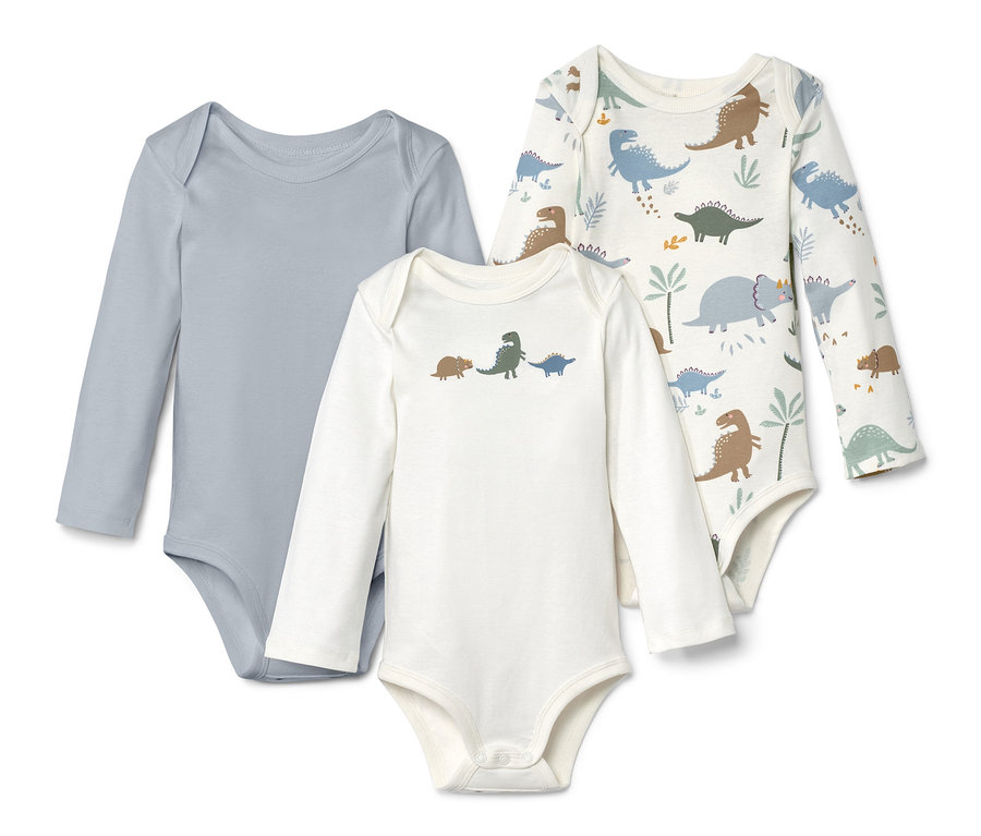 Trzy body z długim rękawem: jedno szare, jedno białe w dinozaury i jedno białe z nadrukiem dinozaurów.