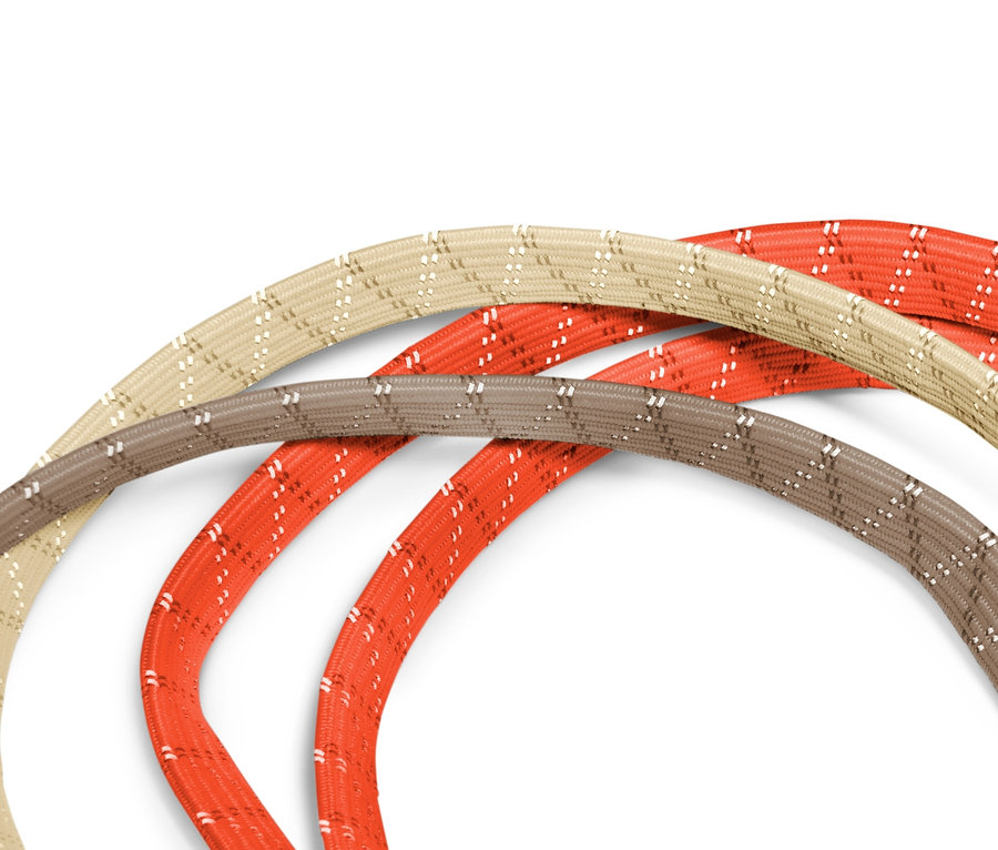 Trzy paski mocujące do roweru w kolorach beżowym, brązowym i pomarańczowym.