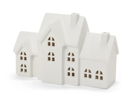 Dekoracyjny biały porcelanowy domek z czterema oknami i kominem.