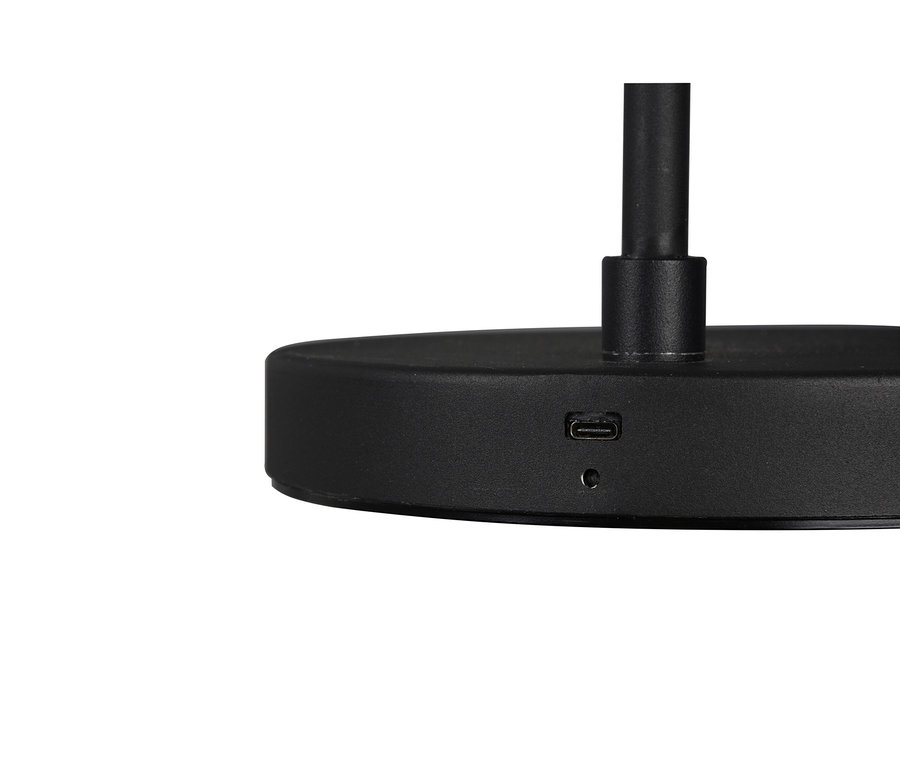 Zbliżenie na matową czarną podstawę lampy z portem USB-C i małą okrągłą lampką kontrolną.