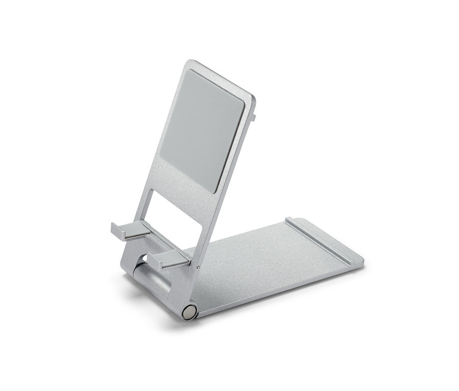 Srebrny stojak na smartfon lub tablet.