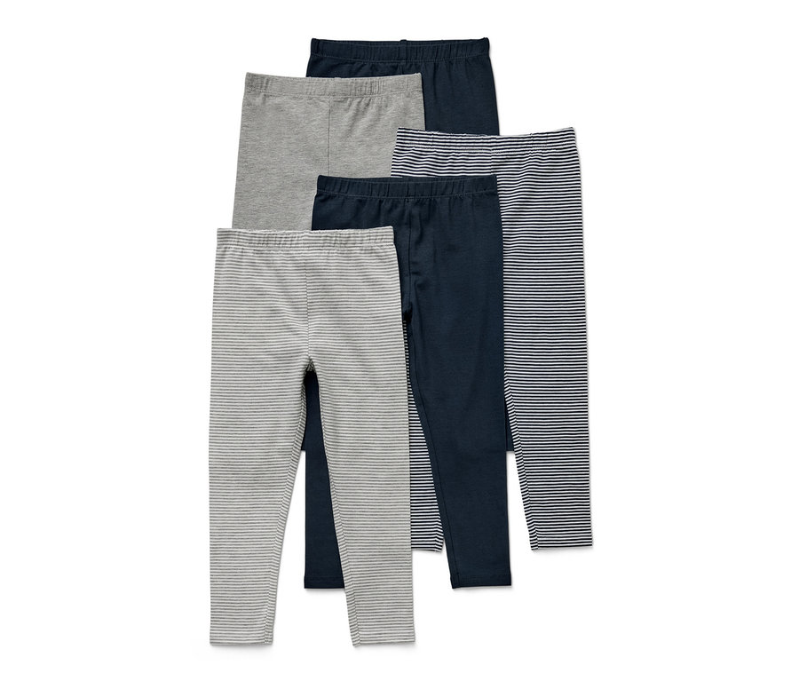 Pięć par legginsów dziecięcych w różnych kolorach i wzorach.