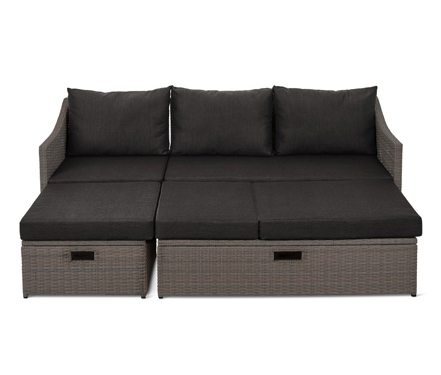 Rozkładana sofa »Thore« z miejscem do przechowywania i ciemnoszarymi poduszkami.