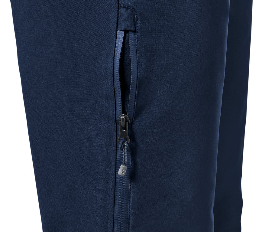 Fragment niebieskich spodni narciarskich ze zamkiem błyskawicznym.