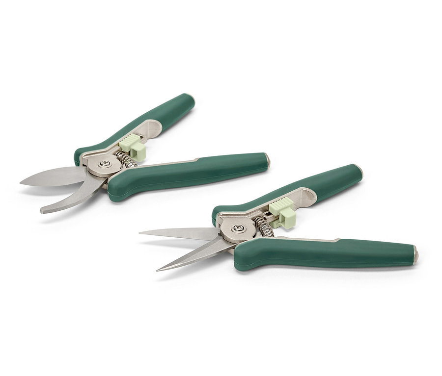 Dwa minisekatory leżą na białej powierzchni.