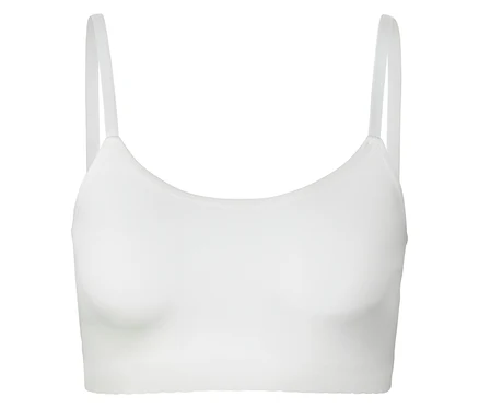 Biały biustonosz typu bralette z cienkimi ramiączkami.