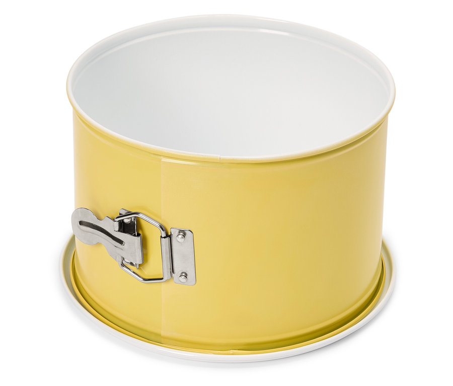 Żółta forma do pieczenia z białą stroną wewnętrzną i srebrnym zamknięciem na białym tle.