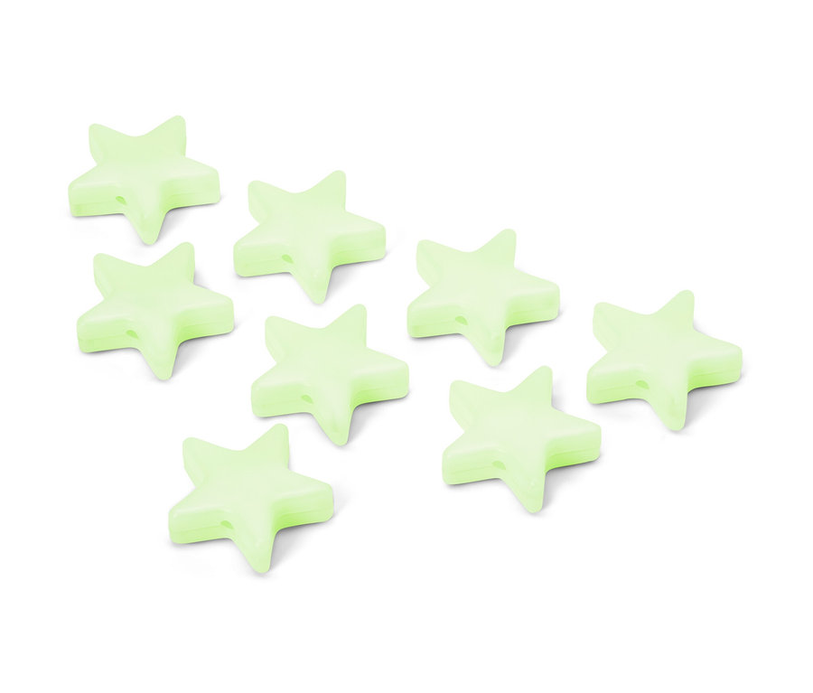 Osiem świecących w nocy klipsów w kształcie gwiazdy na białym tle.