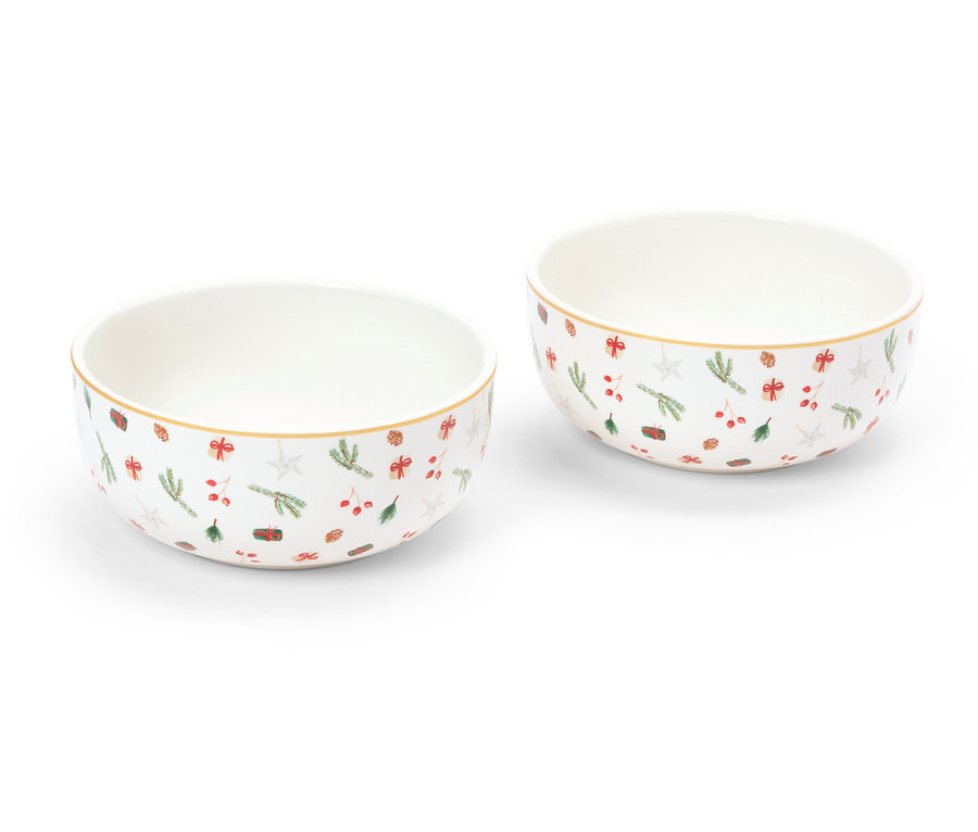 Dwie miski z motywem świątecznym stoją na białym tle.