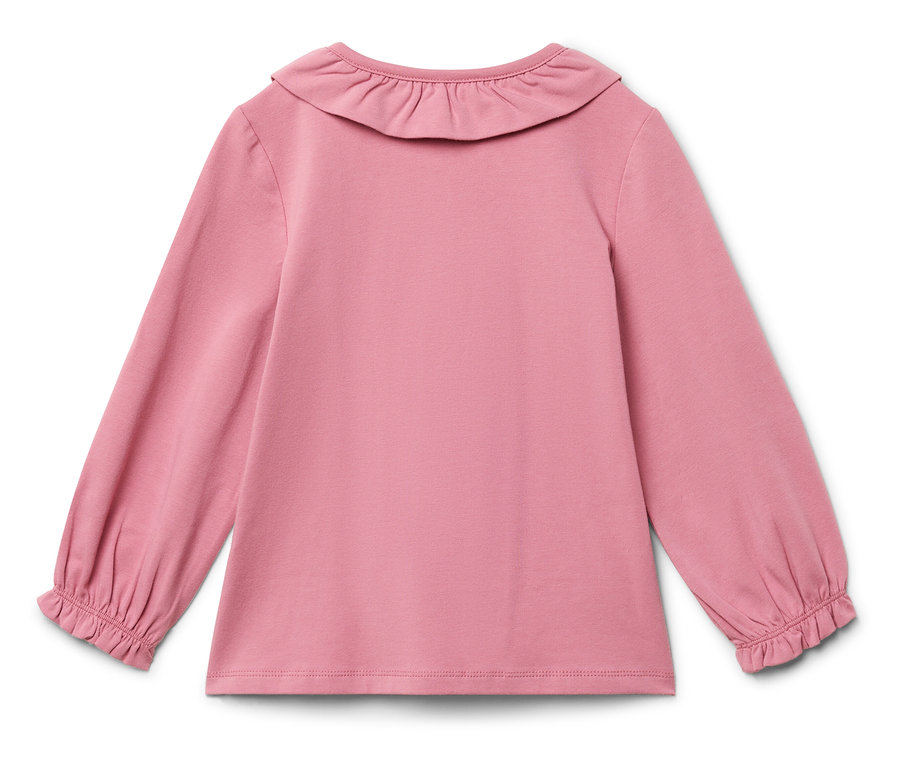 Różowa bluzka z długim rękawem i falbanką przy szyi.