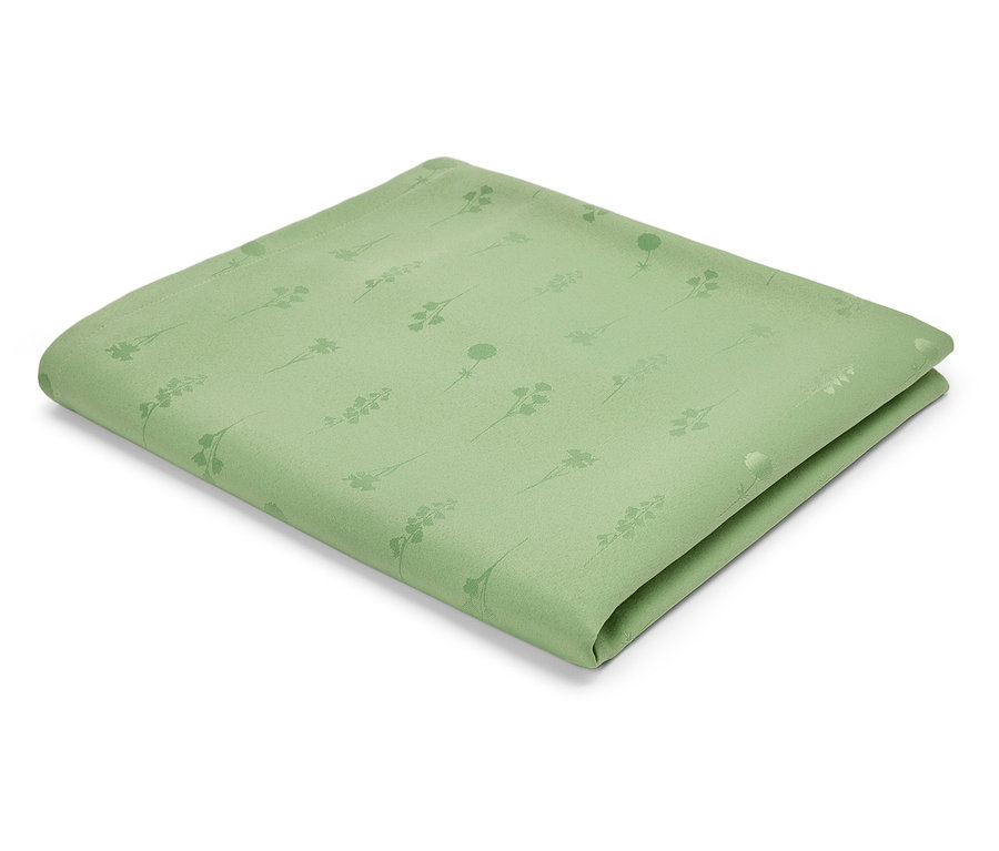 Jasnozielona serwetka z tkaniny we wzór łodyg i kwiatów.