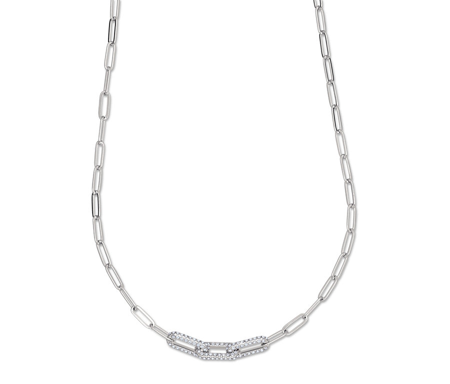 Srebrny łańcuszek z ozdobnym ogniwem pośrodku.