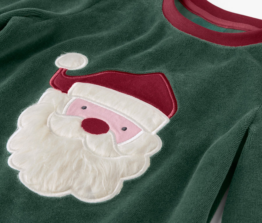 Zielony świąteczny sweter z aplikacją Świętego Mikołaja.