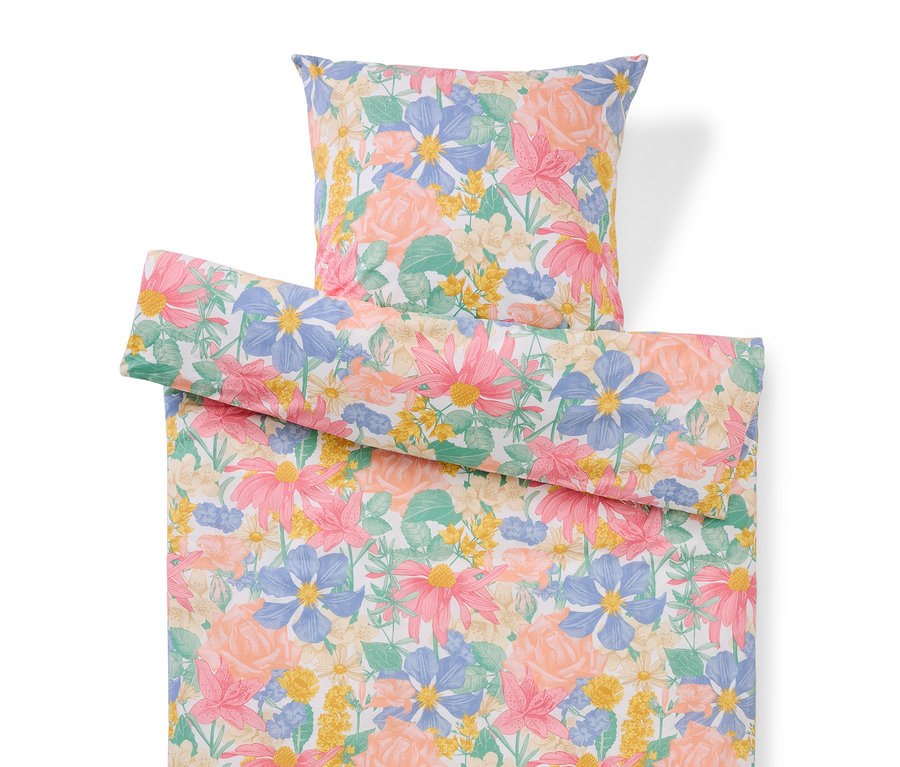 Zestaw pościeli w kwiaty z poduszką i poszwą.