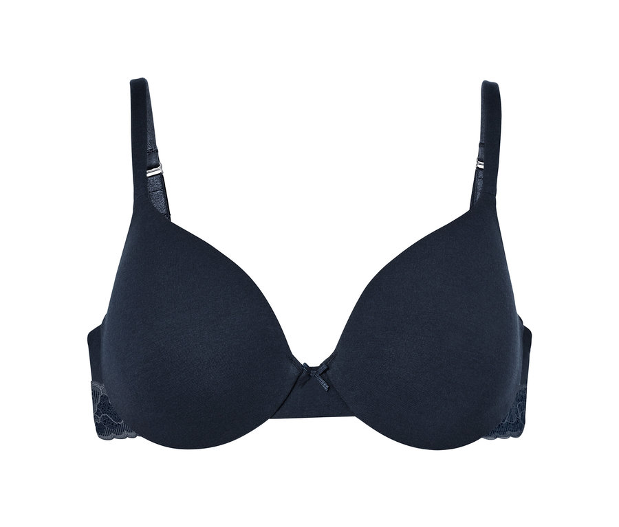 Granatowy biustonosz pod T-shirt z kokardką pośrodku.