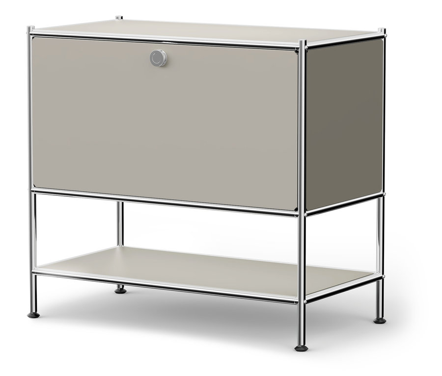 Szara szafka z chromowaną ramą i okrągłym guzikiem.